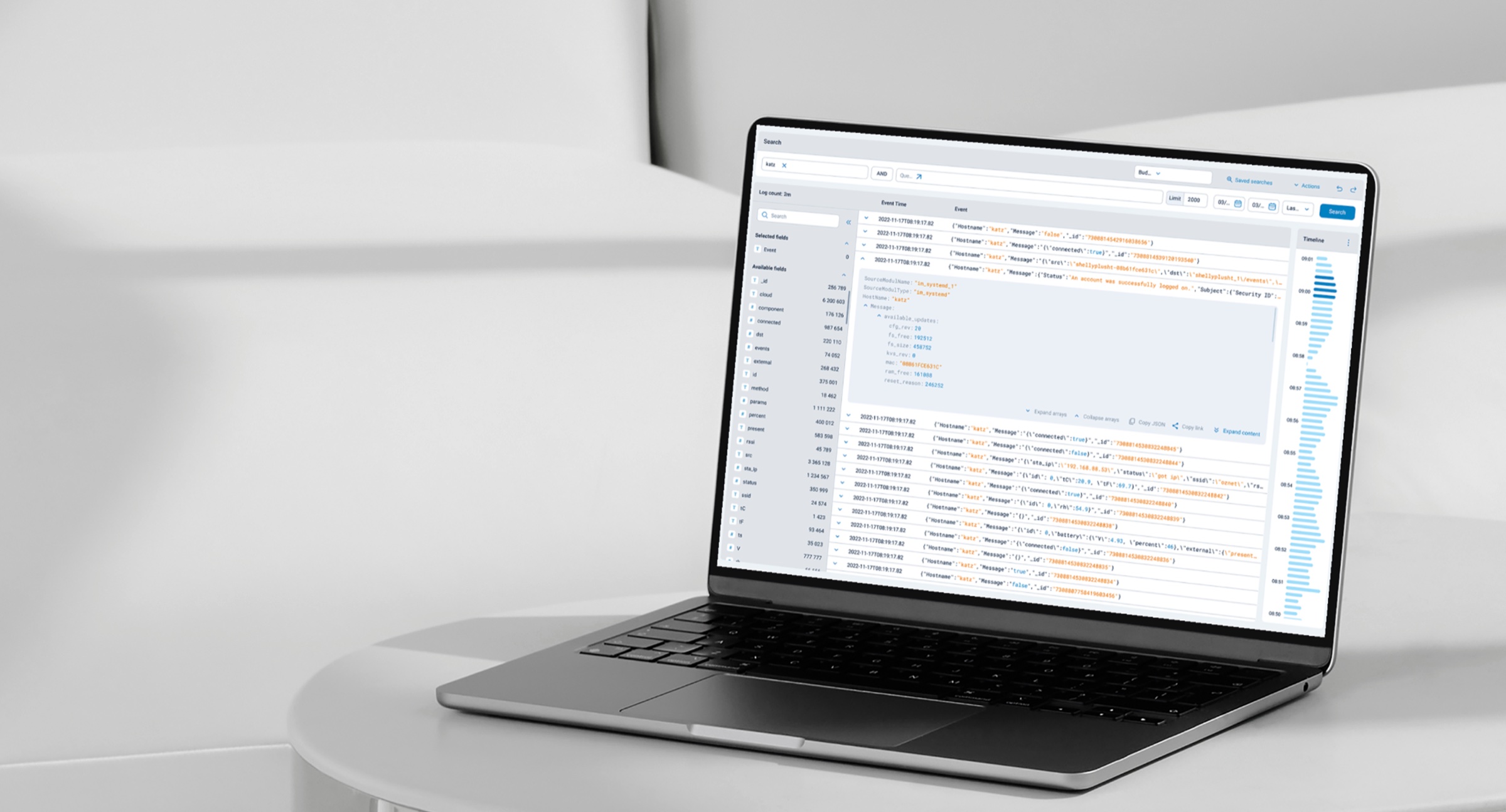 The redesigned NXLog log search interface on a laptop